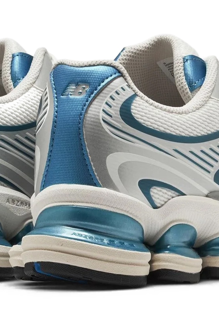סניקרס ניו באלאנס NEW BALANCE תכלת כסוף טקסטיל גזרת מיד דגם ABZORB 2000 U20007YS בולמי זעזועים